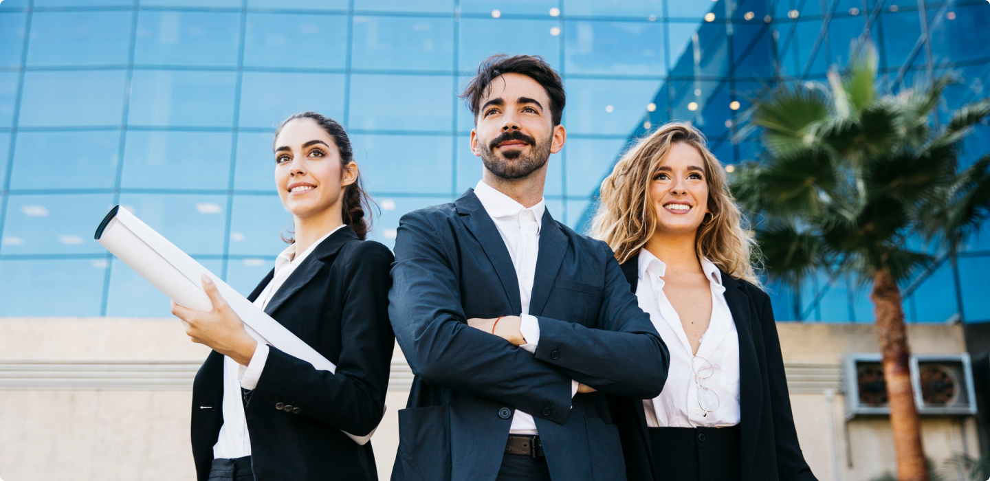 It is an image of three people standing beside each other